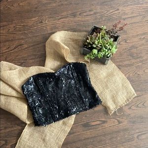 A black Sequence crop top